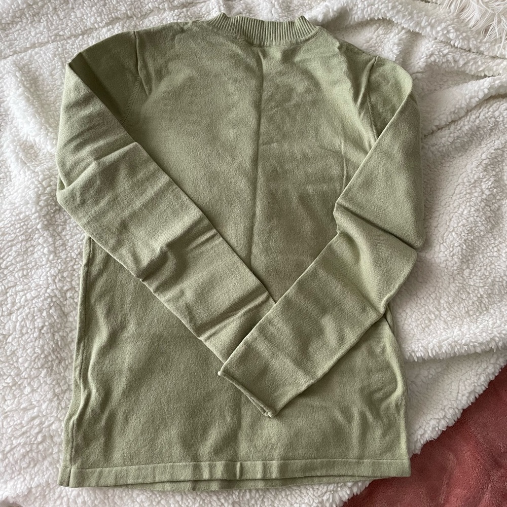 Light green mockneck sweater